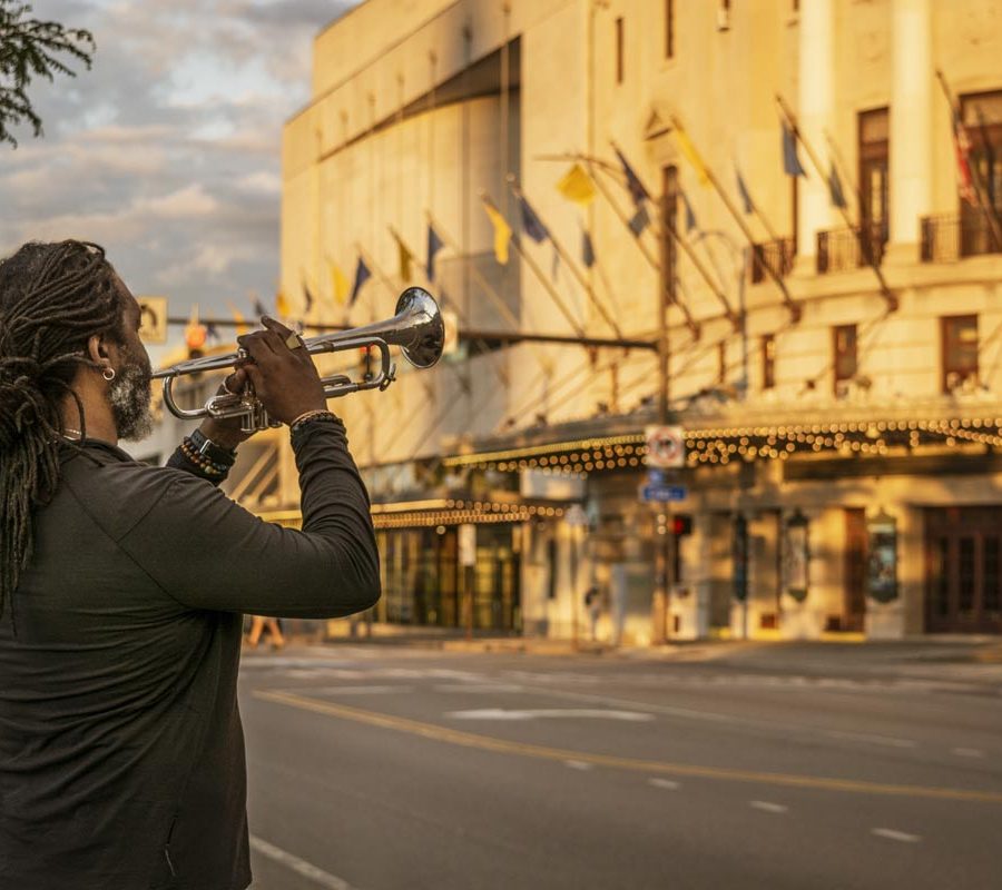 Herberts Smith addressing the Eastman Theater with his trumpet